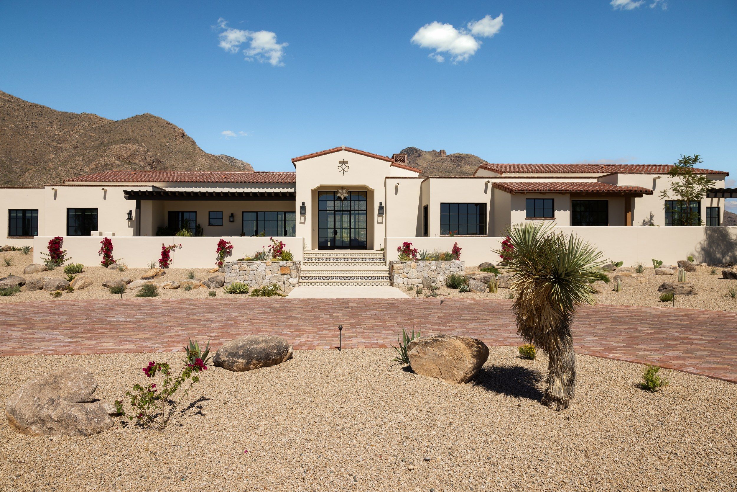 Front elevation with desert landscaping and a yucca in the foreground